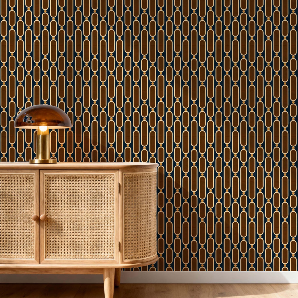 May include: A cabinet with a light-colored woven cane front and a rounded side, topped with a dome-shaped glass lamp. The wall behind features a repeating geometric pattern of vertical gold-colored ovals linked by small circles on a dark background.